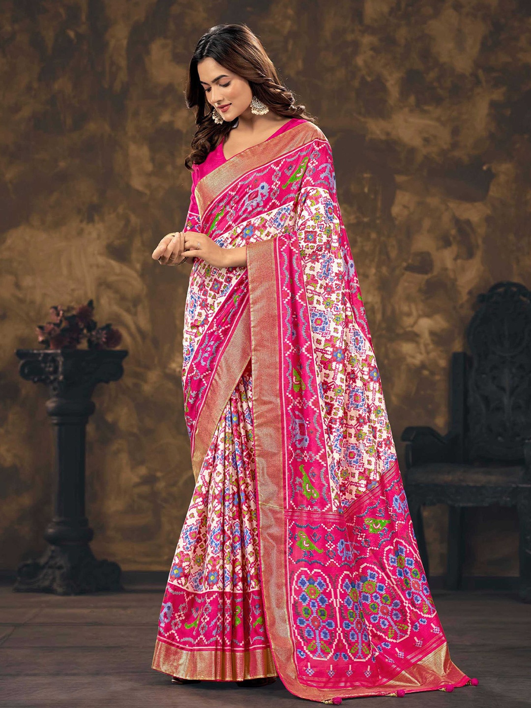 

Mitera Pink & White Ethnic Motifs Printed Zari Silk Blend Patola Saree