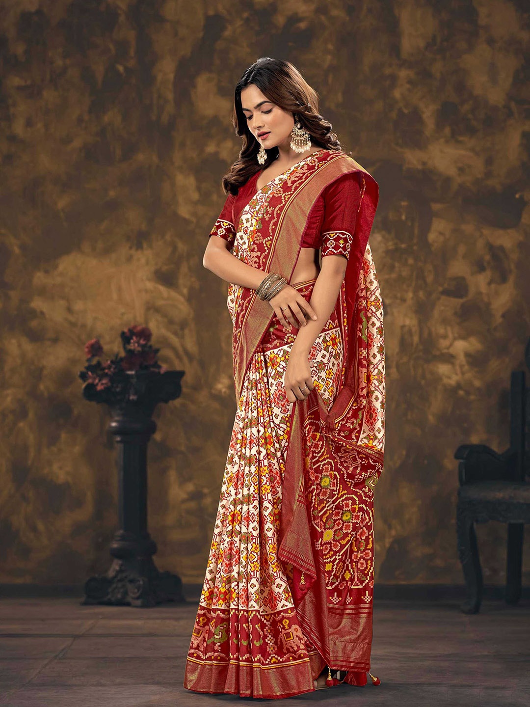 

Mitera Red & White Ethnic Motifs Printed Zari Silk Blend Patola Saree