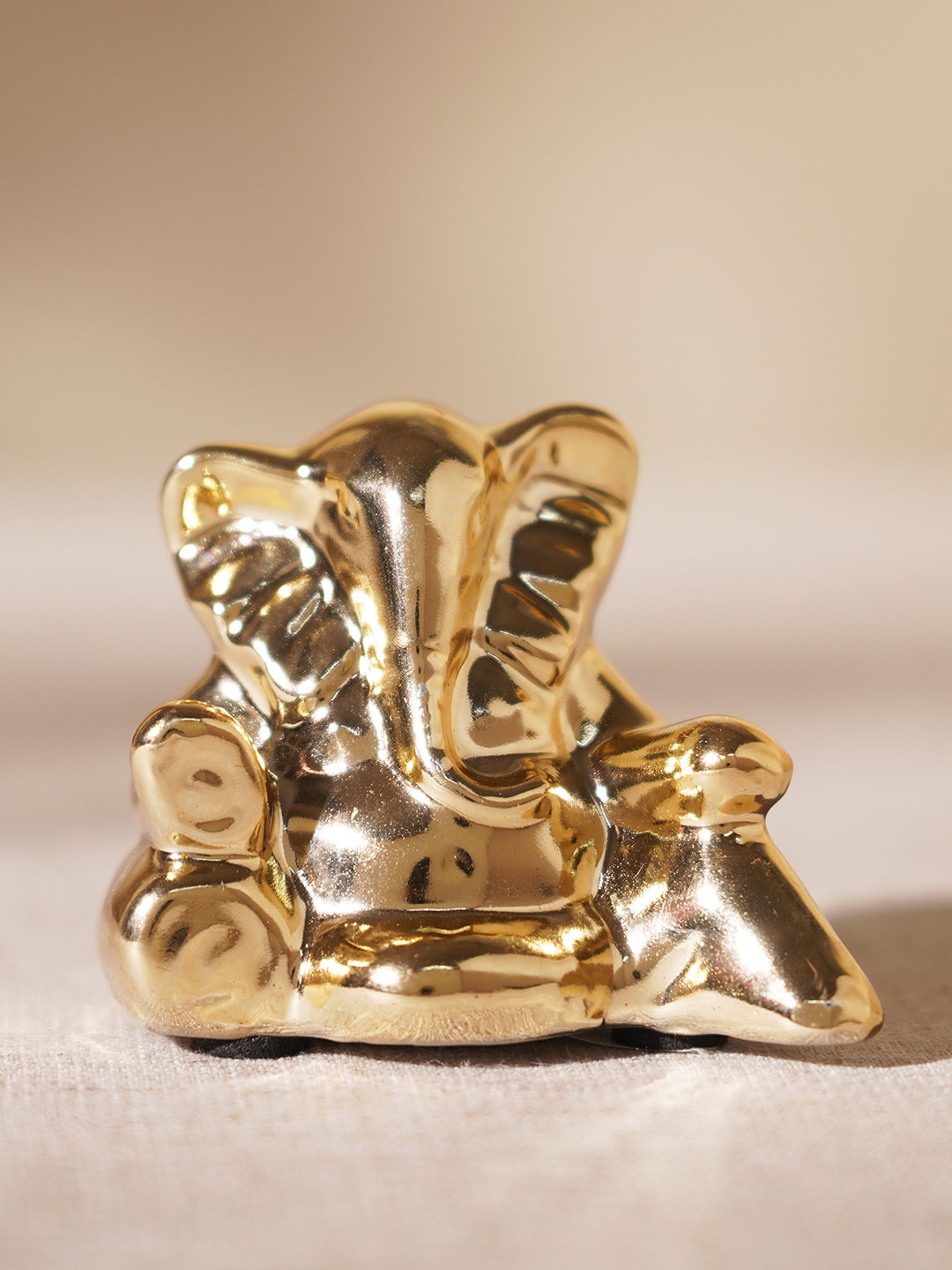 

Pure Home and Living Beige Textured Ganesha Idol Showpiece, Gold