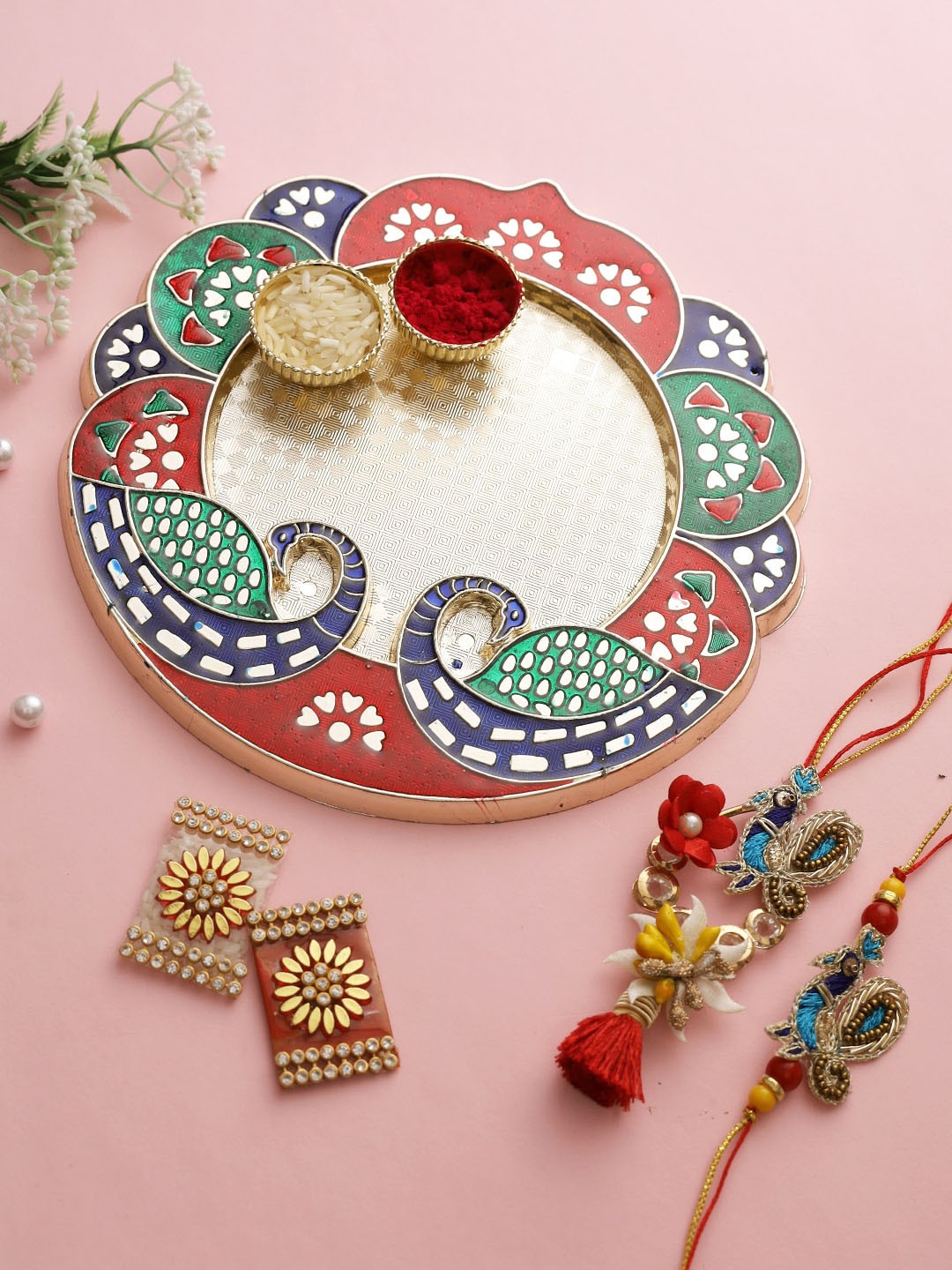 

Aapno Rajasthan Unisex Rakhis WIth Peacock Shape Thali & Kumkum Chawal, Multi