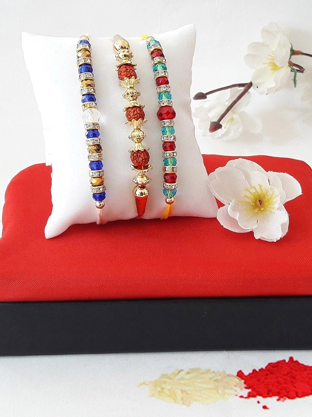 

TIED RIBBONS Set of 3 Beaded Rudraksha Rakhi with Greeting Card & Roli Chawal, Red