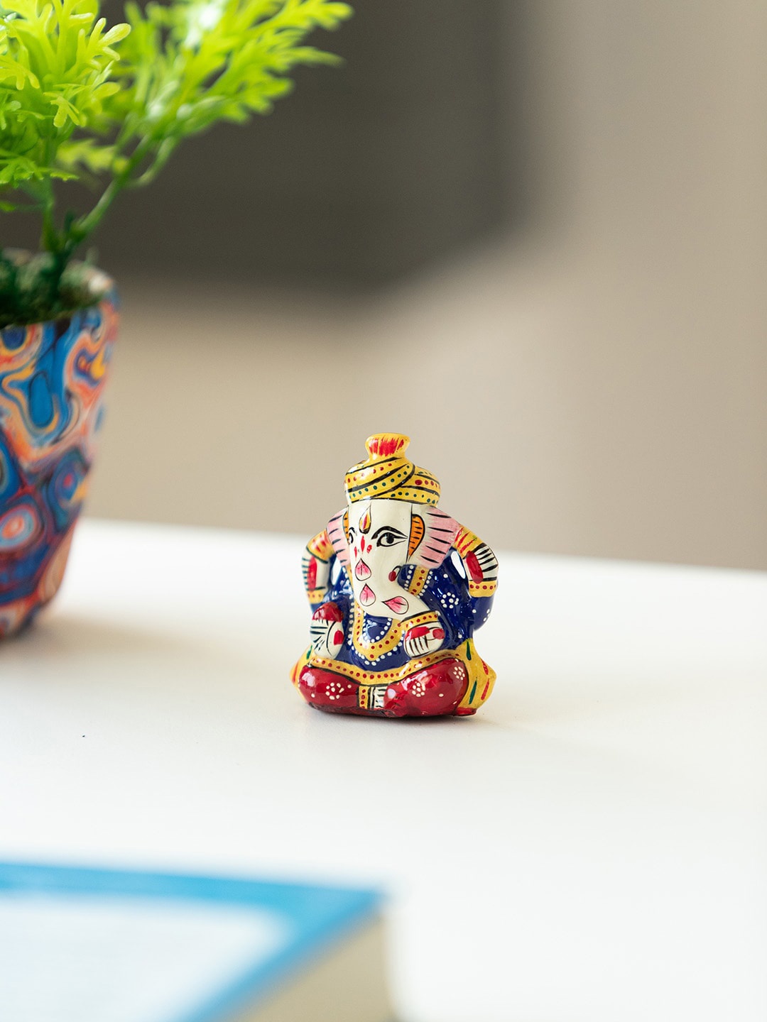 

ExclusiveLane Blue & Red Car Ganesha Showpiece