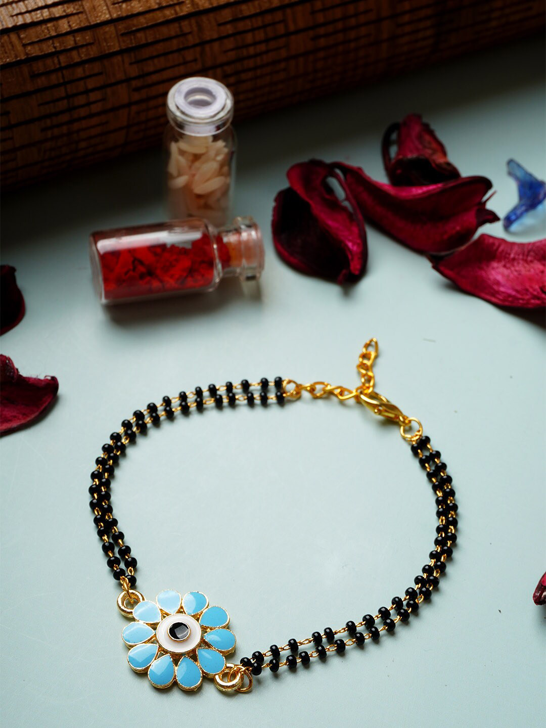 

Ferosh Gold-Plated Flower Evil Eye Mangalsutra Beads Rakhi