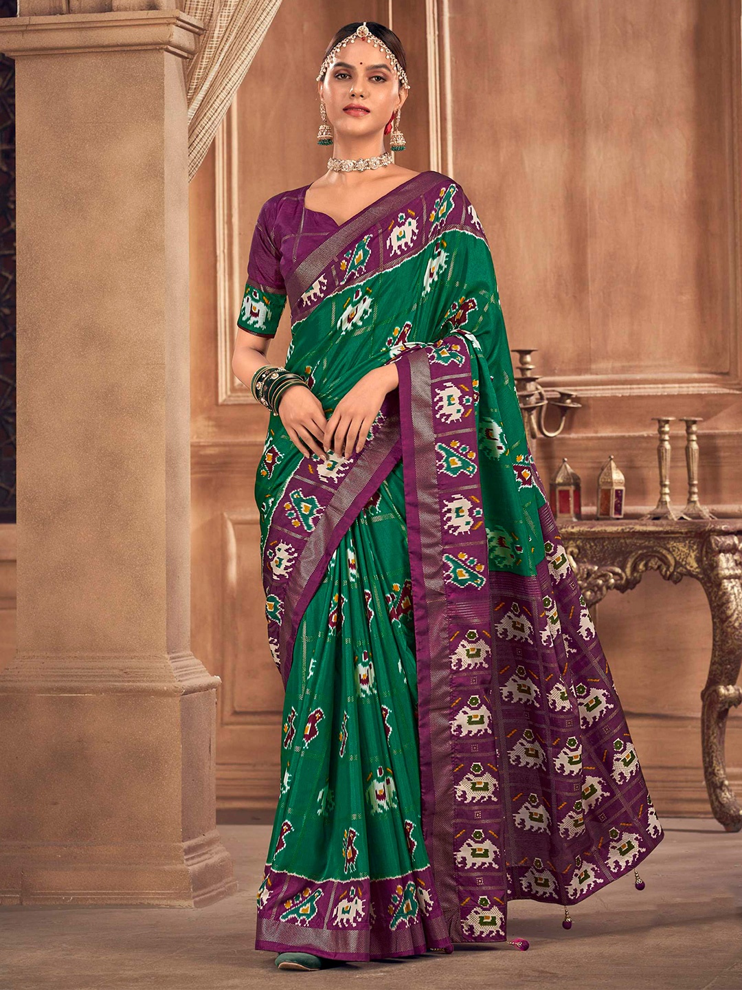 

Mitera Green Ethnic Motifs Woven Design Patola Saree