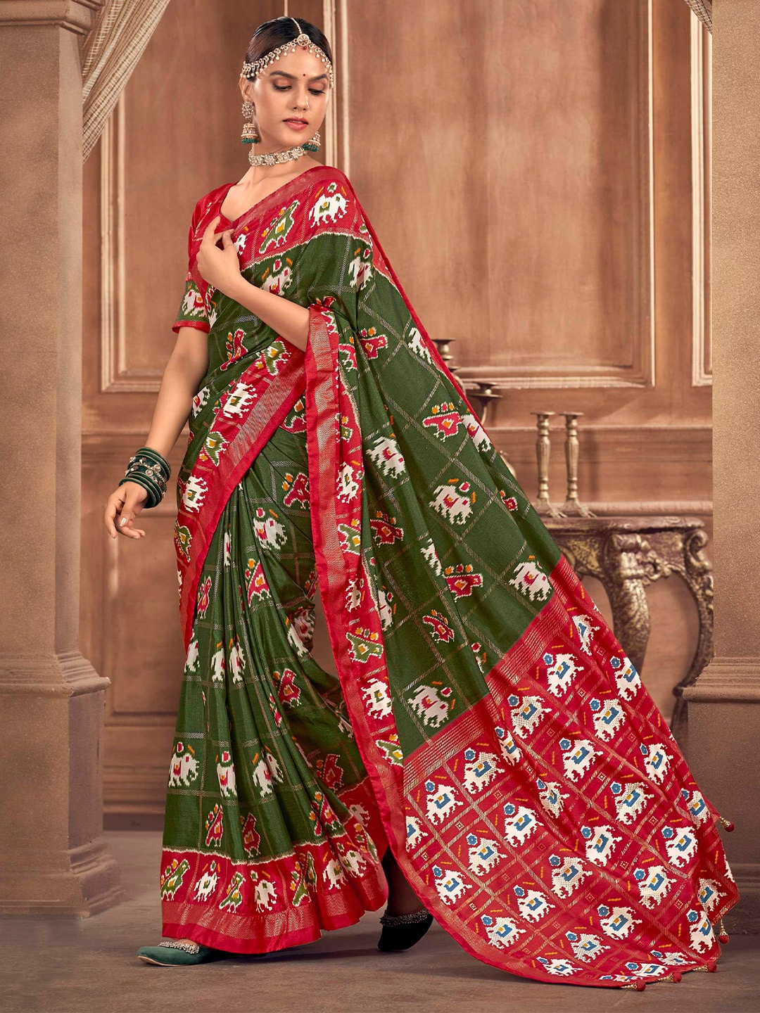 

Mitera Green Ethnic Motifs Woven Design Patola Saree
