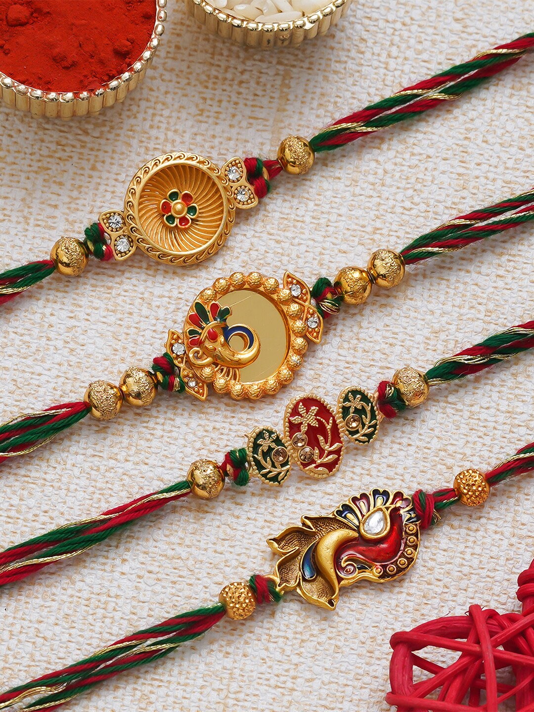 

eCraftIndia Set of 4 Ganesha Peacock & Floral Designer Rakhis with Roli Chawal, Red
