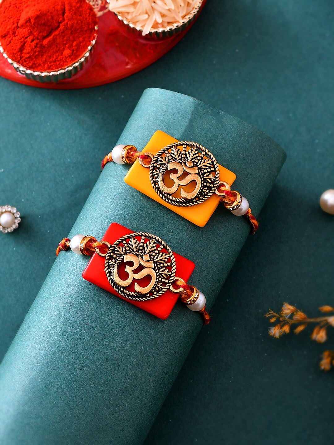 

Aapno Rajasthan Set Of 2 Om Antique Rakhis With Kumkum Chawal & A Card, Gold