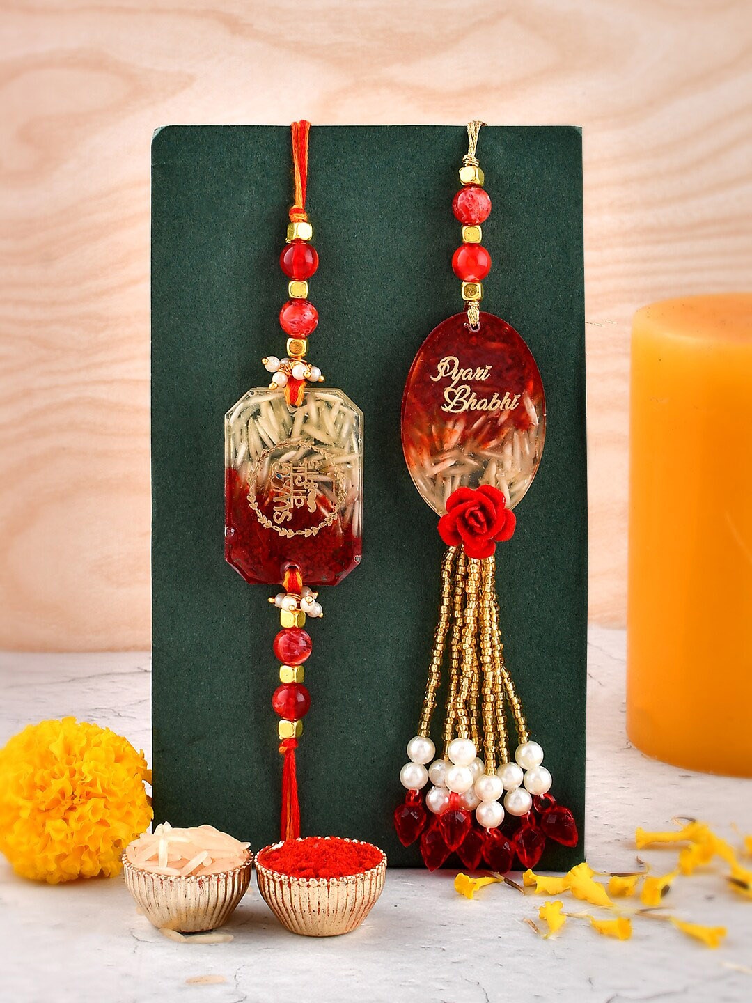 

Aapno Rajasthan Unisex Set of 2 Resined Bhaiya Bhabhi Rakhis with Roli Chawal and Card, Red
