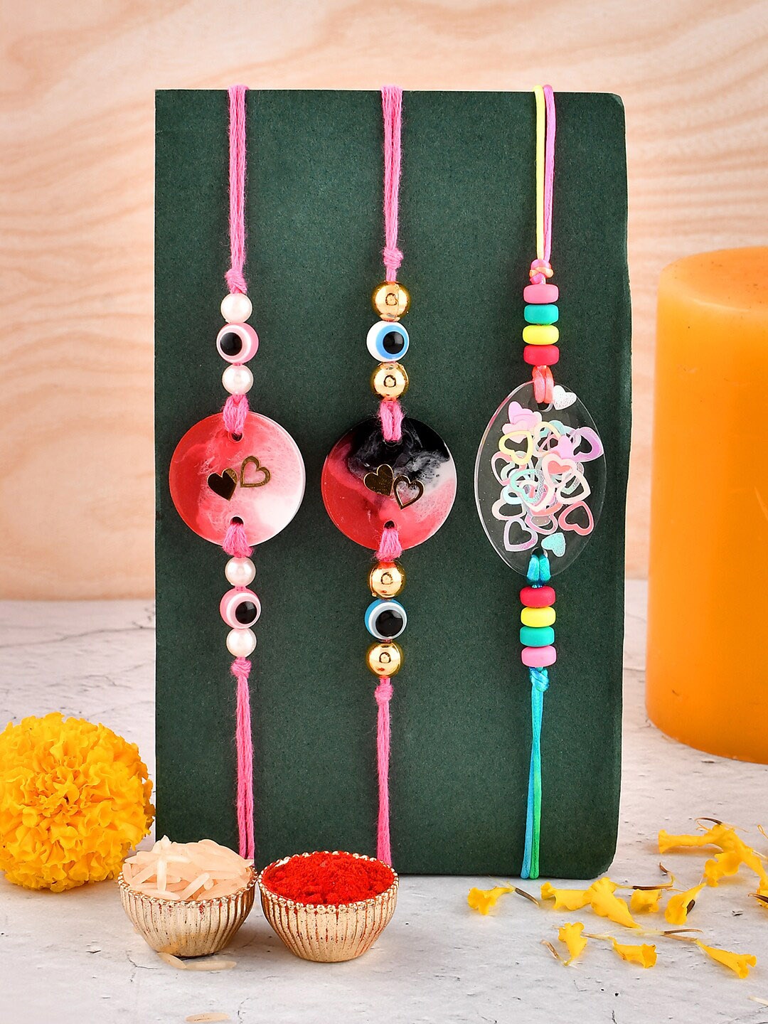 

Aapno Rajasthan Set Of 3 Love Resin Rakhi Gift Set, Multi