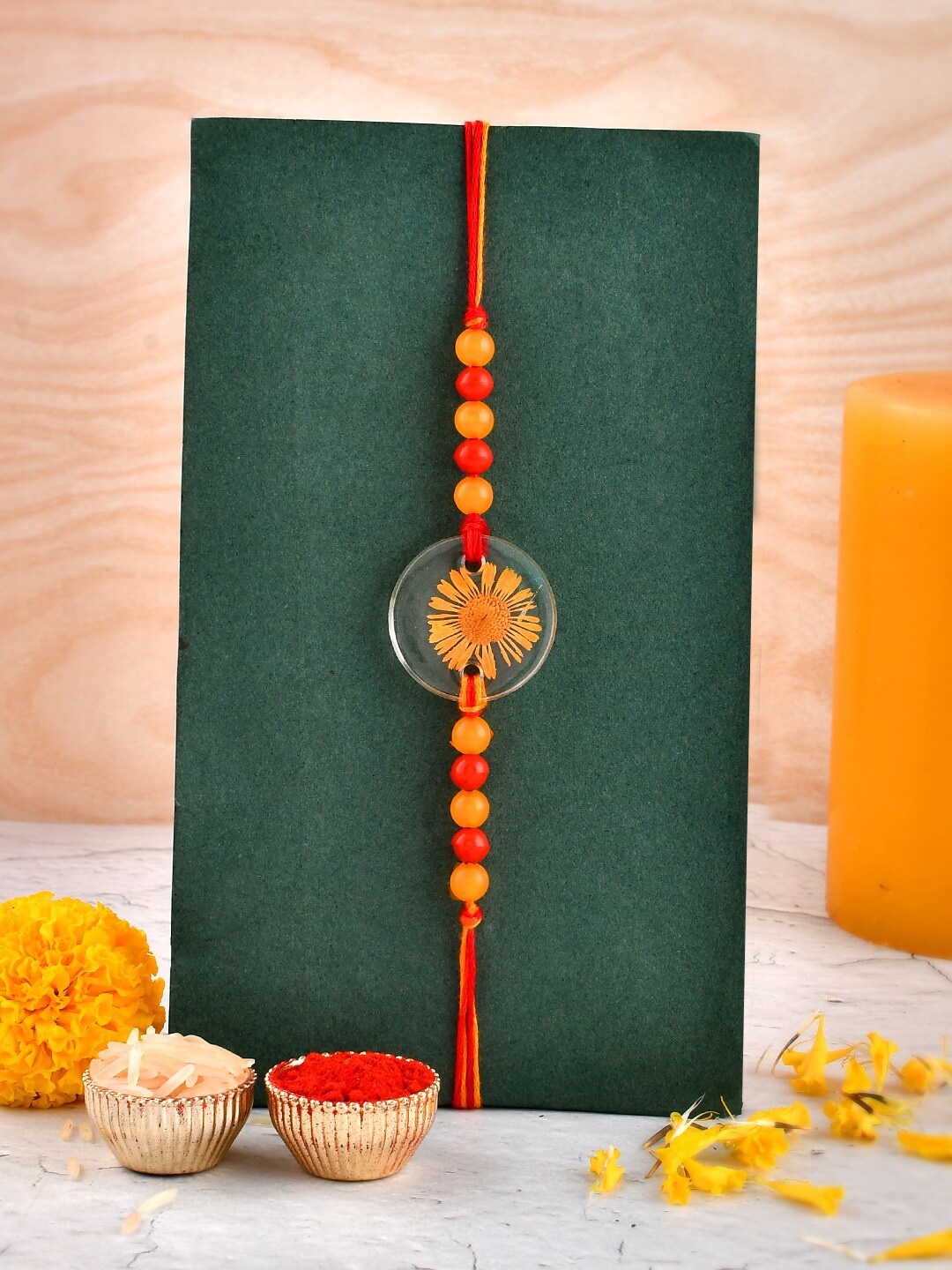 

Aapno Rajasthan Real Dried Flower Beaded Rakhi with Greeting Card & Roli Rice, Red
