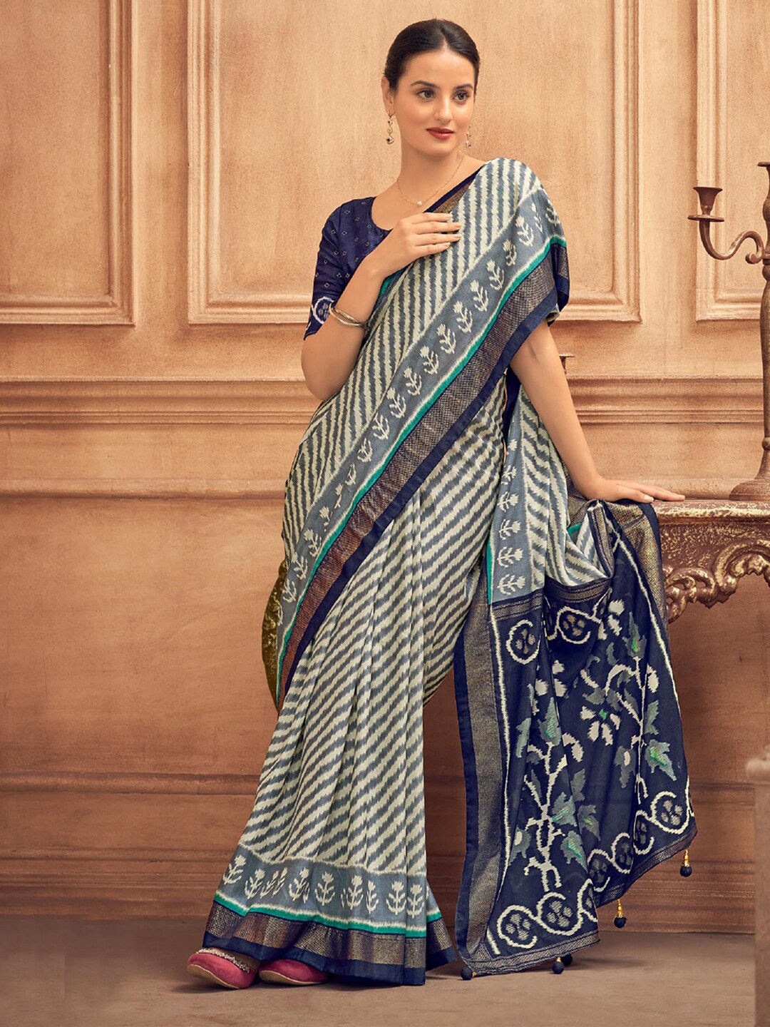 

Mitera Grey Leheriya Printed Zari Detailed Saree