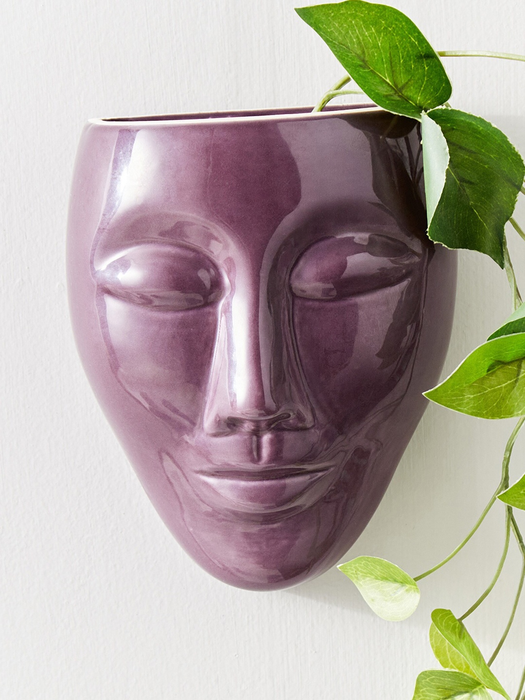 

Home Centre Purple Ceramic Face Planter