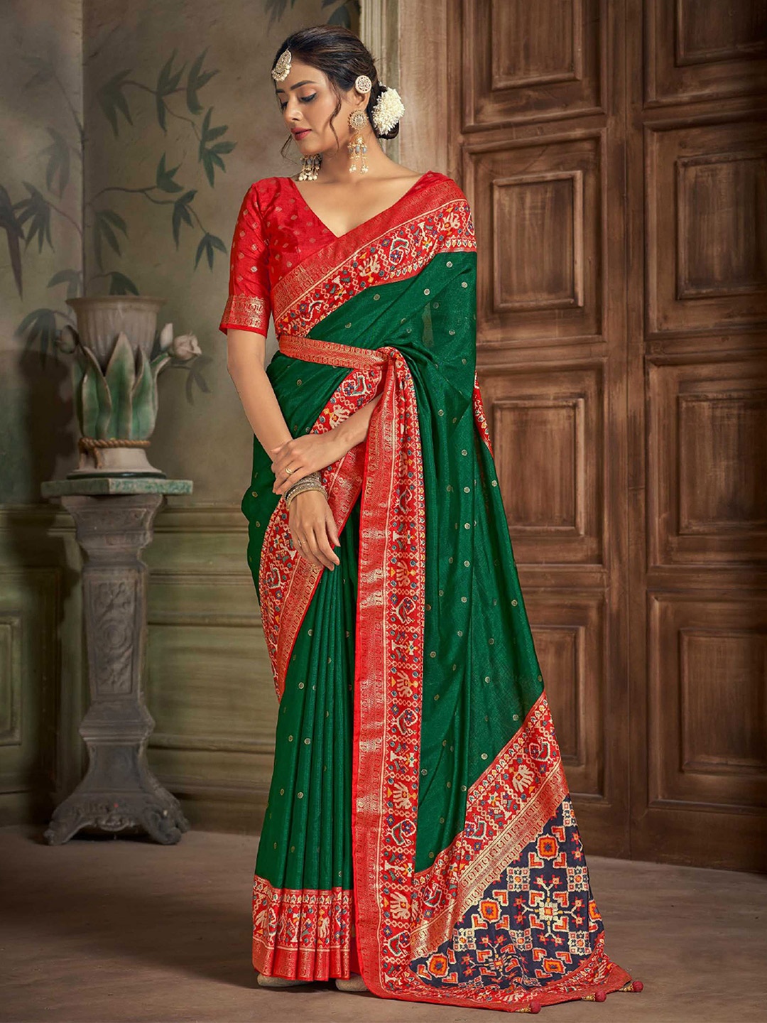 

Mitera Green Geometric Woven Design Zari Detailed Patola Saree