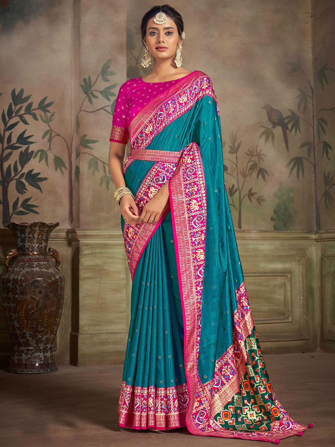 

Mitera Blue Geometric Woven Design Zari Detailed Patola Saree