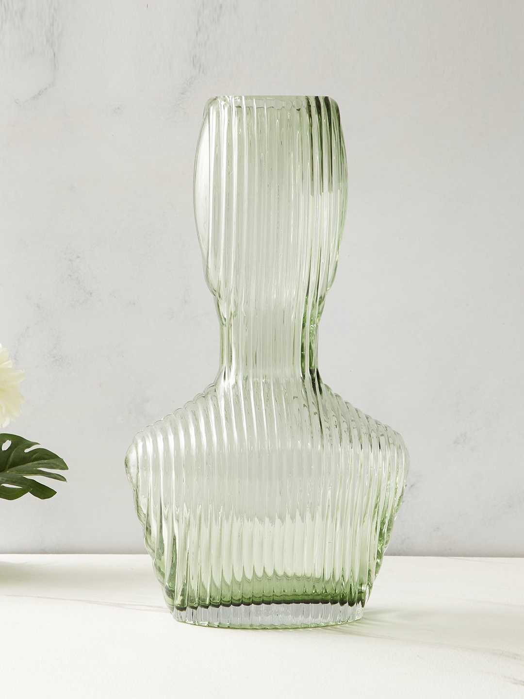

Home Centre Brian Green Glass Ribbed Vase