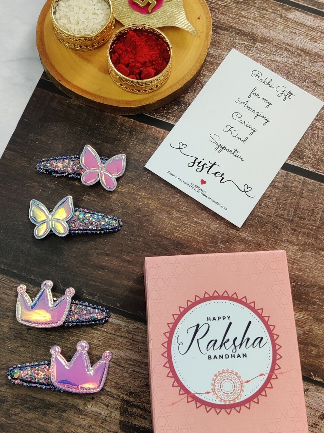 

EL REGALO Girls Set Of 4 Embellished Crown & Butterfly's Tic Tac Hair Clip Rakhi Gift Set, Purple