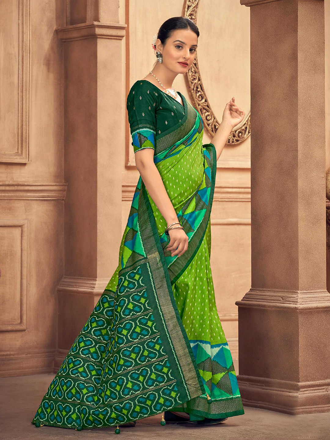 

Mitera Green Geometric Printed Patola Saree