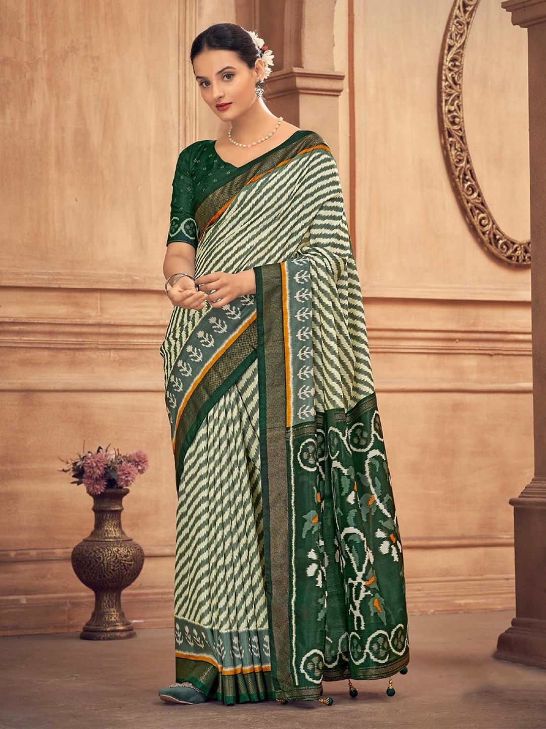 

Mitera Green Leheriya Printed Zari Detailed Patola Saree