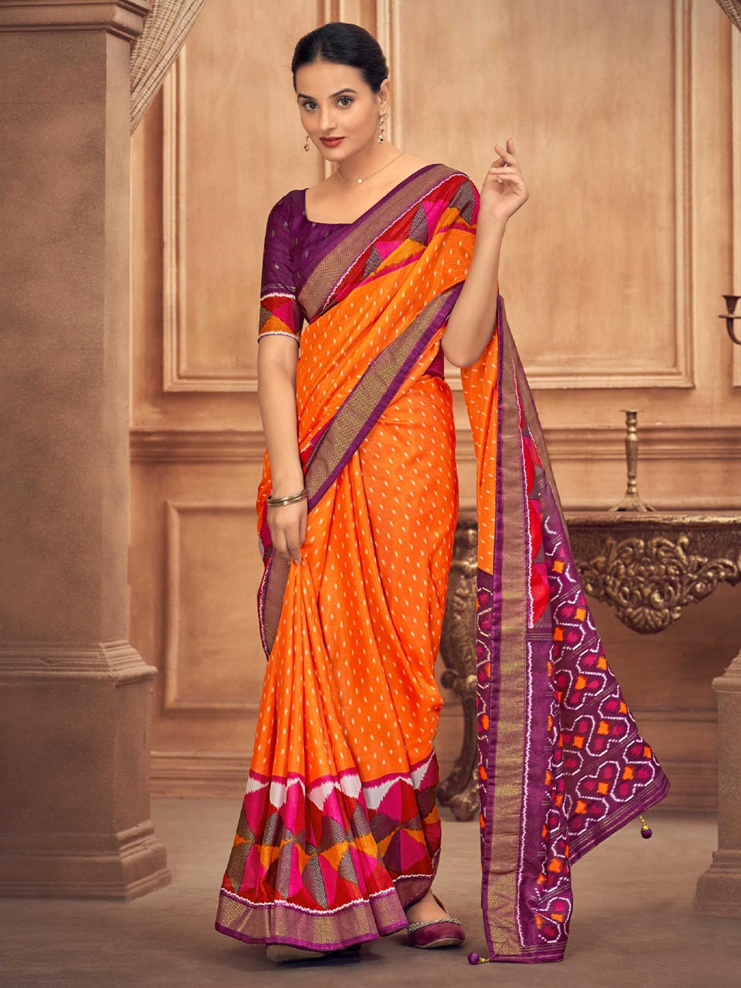 

Mitera Orange Geometric Printed Patola Saree