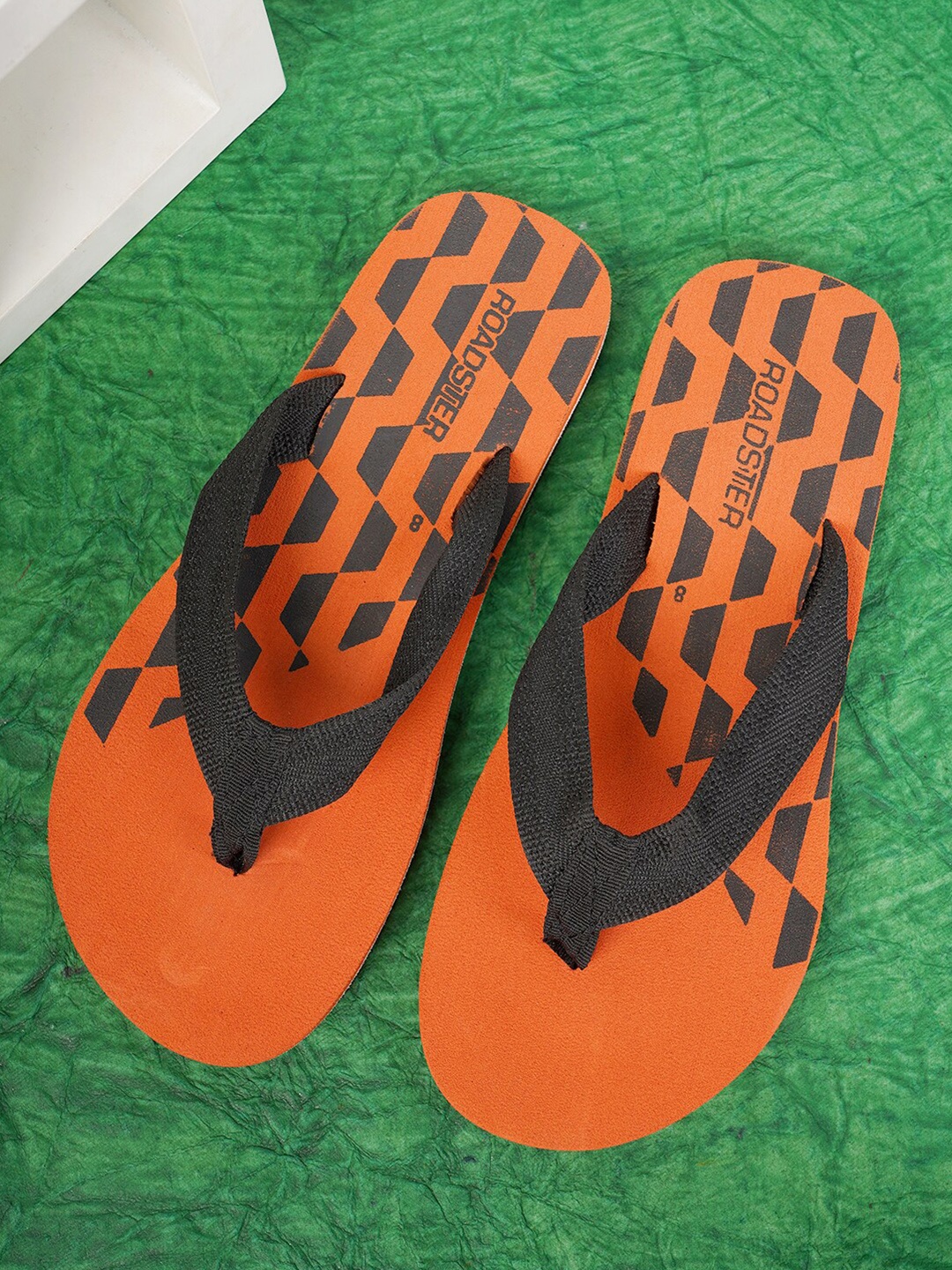 

The Roadster Lifestyle Co. Men Orange & Black Printed Lightweight Thong Flip Flops