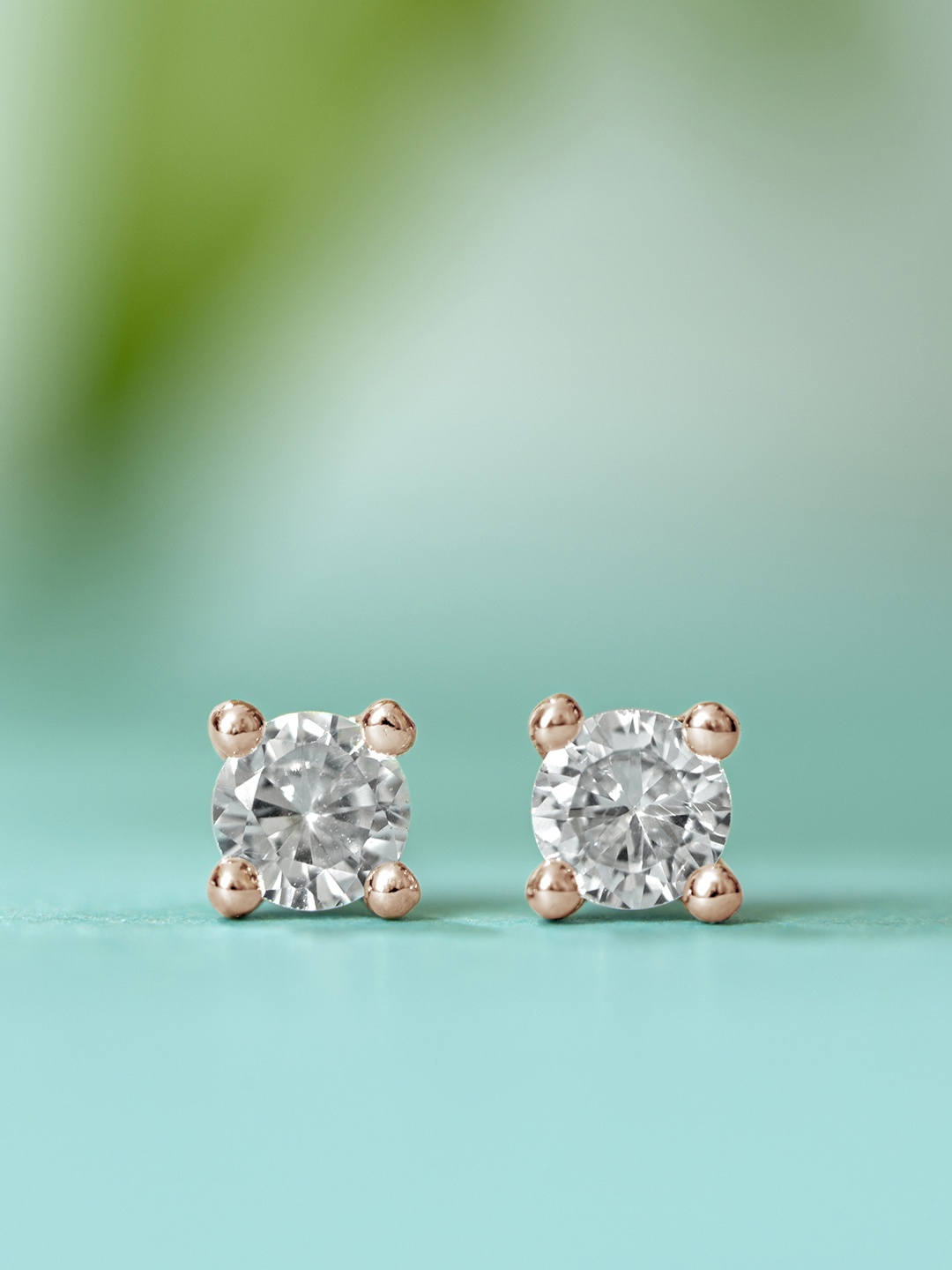 

Zavya Rose Gold-Plated Diamond Shaped Studs Earrings