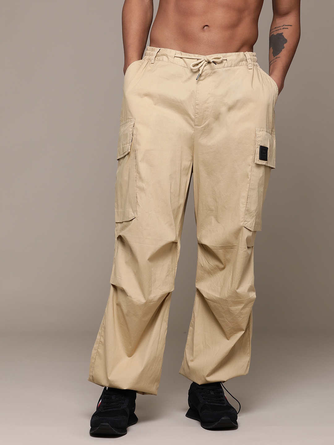 

The Roadster Lifestyle Co. Men Loose Fit Low-Rise Joggers, Beige