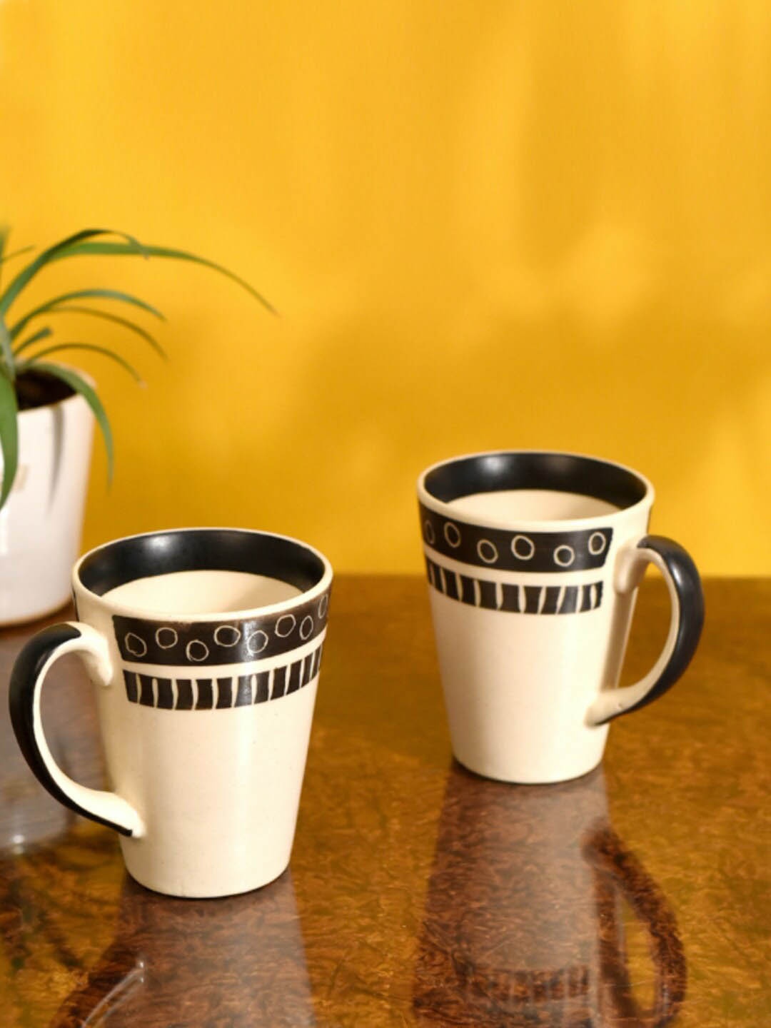 

AAKRITI ART CREATIONS Off White & Black 2 Pieces Printed Ceramic Glossy Mugs 200ml