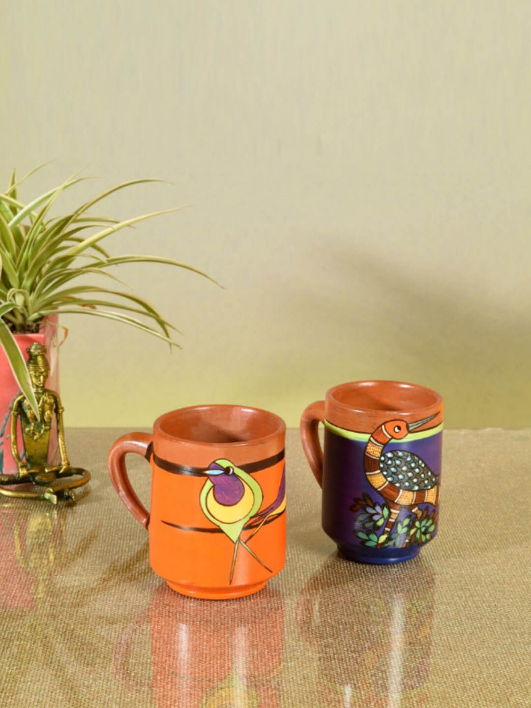 

AAKRITI ART CREATIONS Purple & Orange 2 Pieces Printed Terracotta Matte Mugs