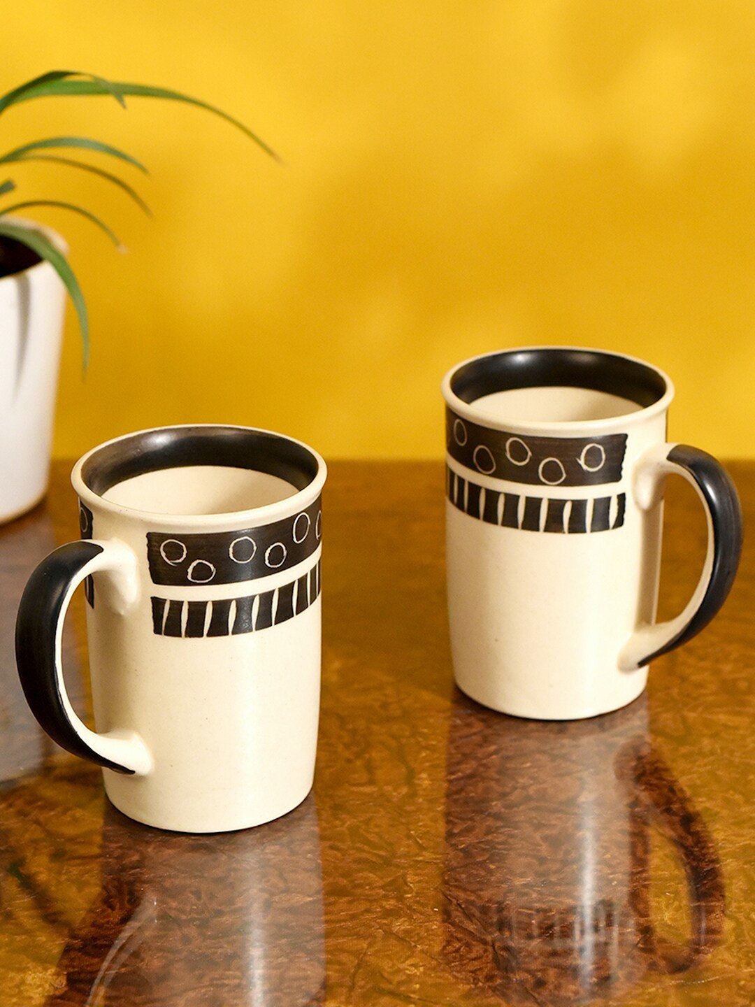 

AAKRITI ART CREATIONS Off White & Black 2 Pieces Printed Ceramic Glossy Mugs - 200 ML Each