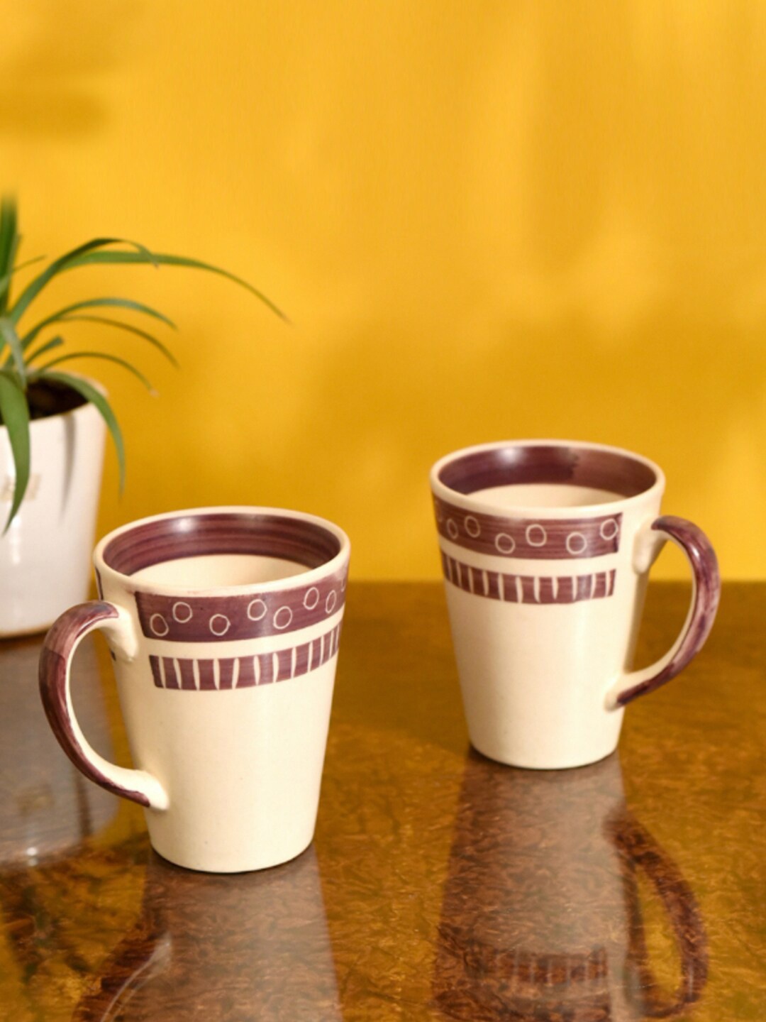 

AAKRITI ART CREATIONS Cream-Coloured & Purple 2 Pieces Printed Ceramic Glossy Mugs 200ml