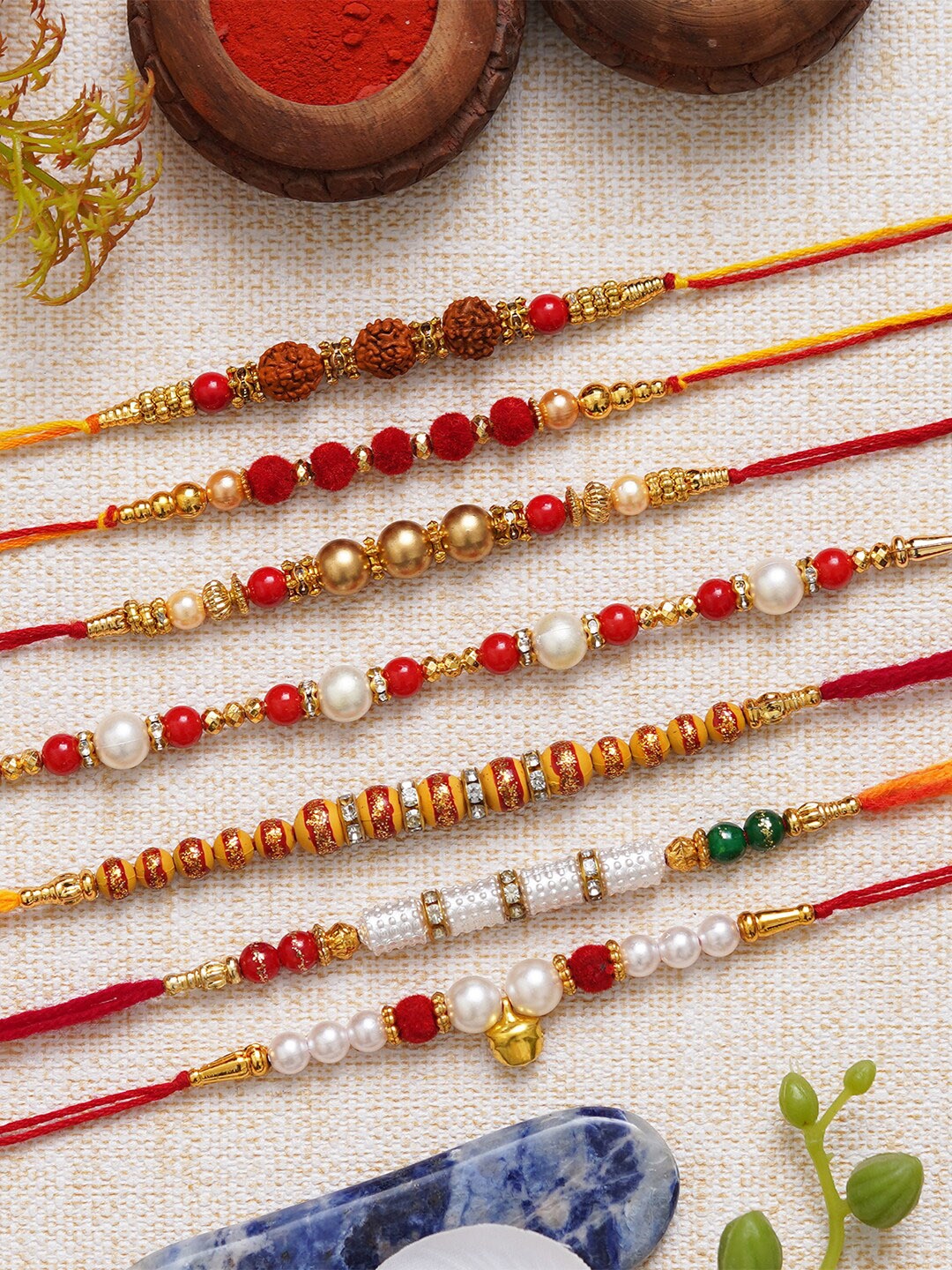 

eCraftIndia Unisex Set Of 7 Beaded Rudraksha Charm Rakhi with Roli & Charm, Red