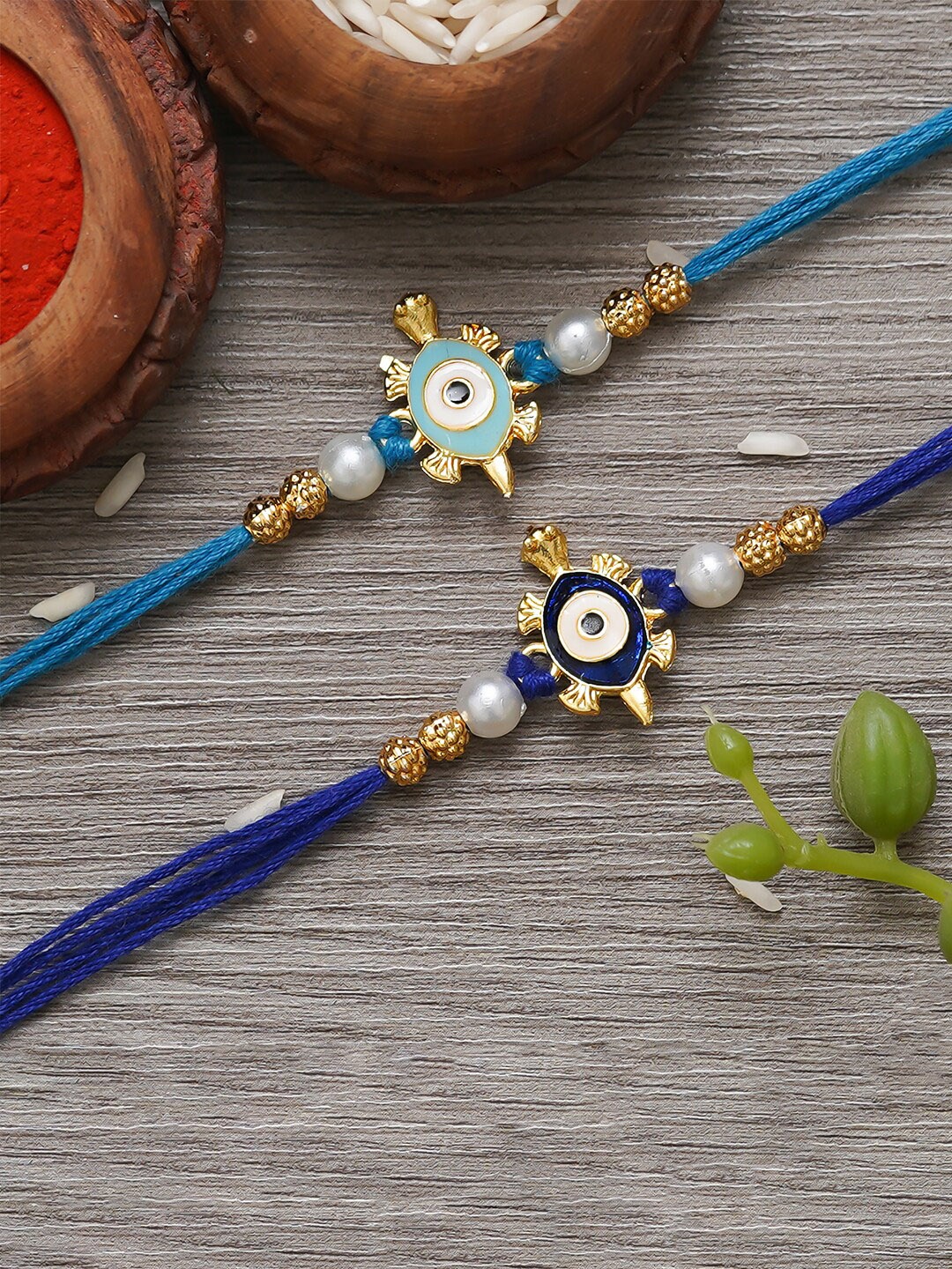 

eCraftIndia Unisex Set Of 2 Evil Eye Tortoise Charm Rakhi With Roli Chawal, Gold