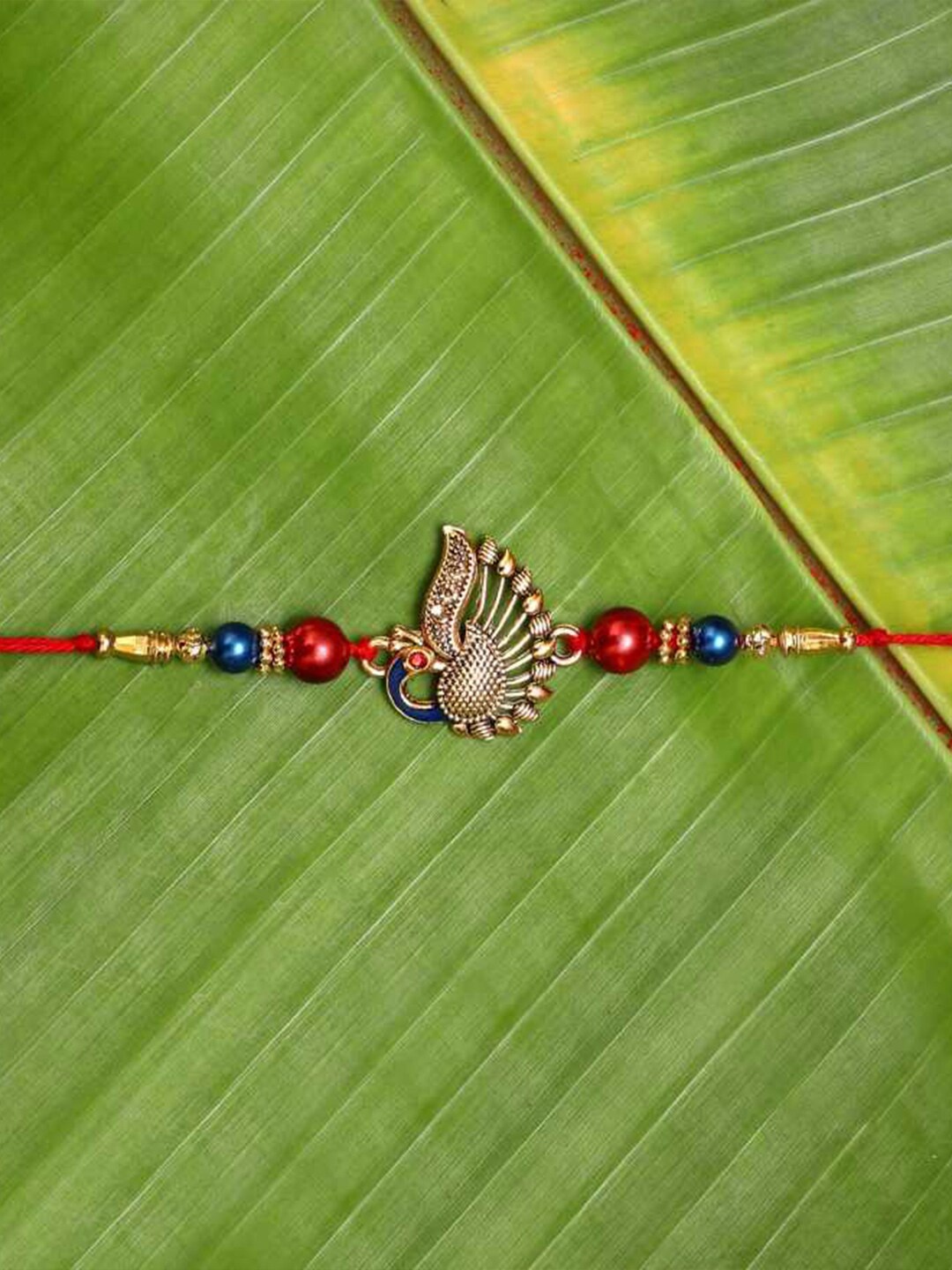 

eCraftIndia Unisex Peacock Charm Rakhi, Red