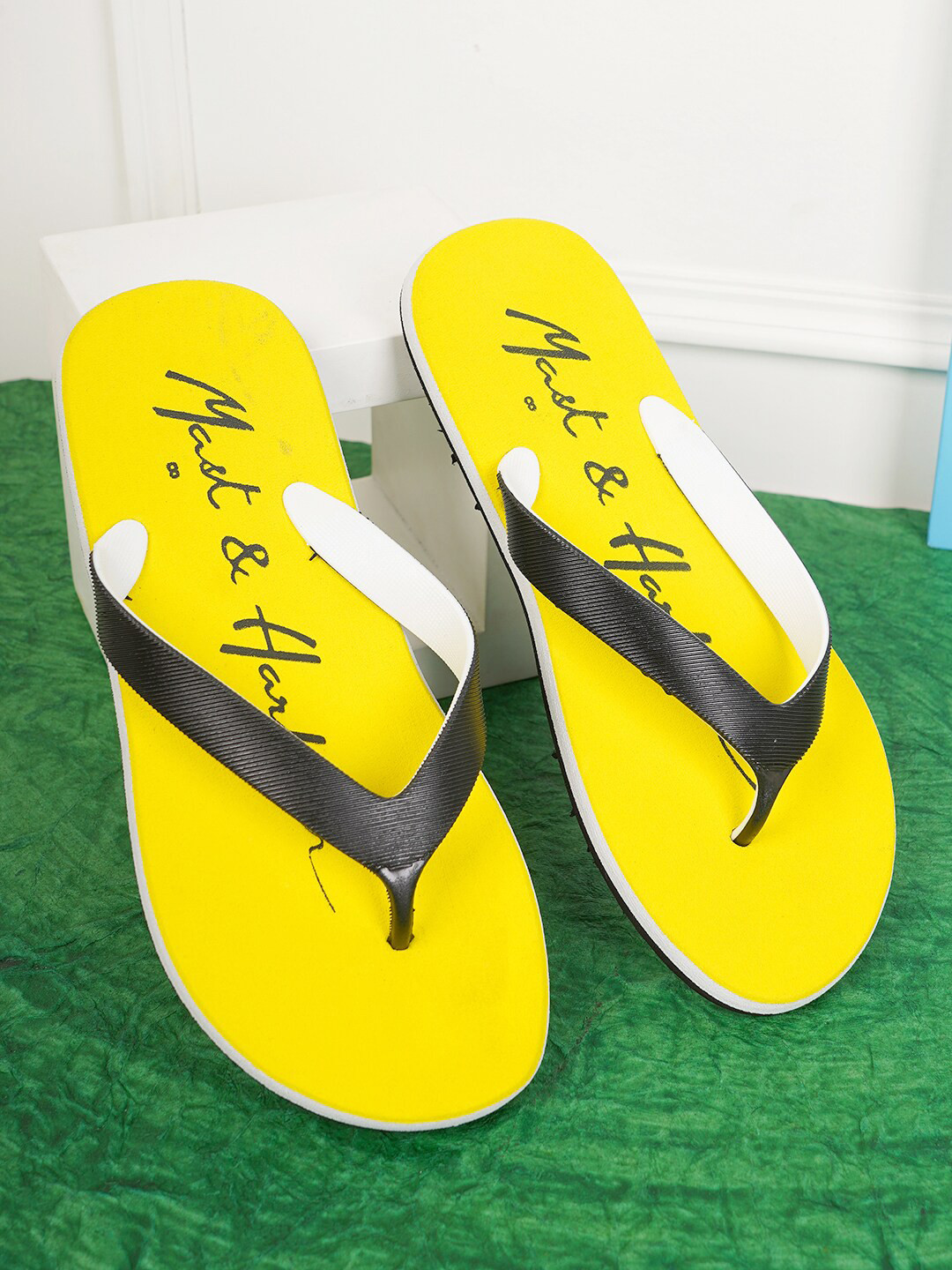 

Mast & Harbour Men Black & Yellow Printed Rubber Thong Flip-Flops