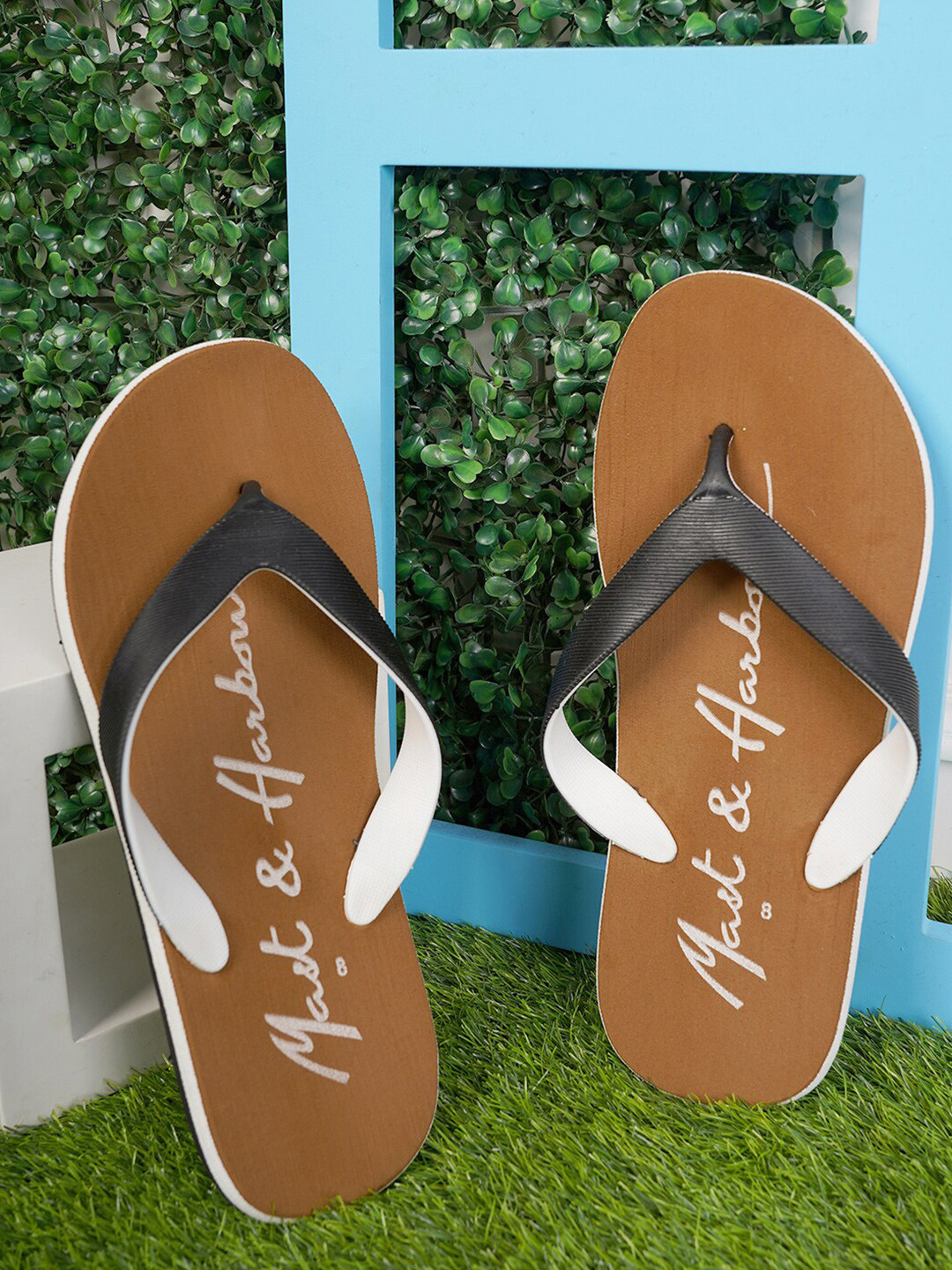 

Mast & Harbour Men Black & Brown Printed Rubber Thong Flip-Flops