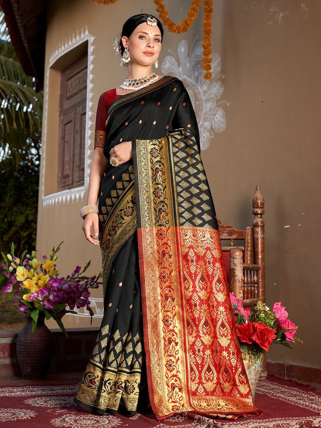 

Anouk Black Ethnic Motifs Woven Design Zari Chanderi Saree