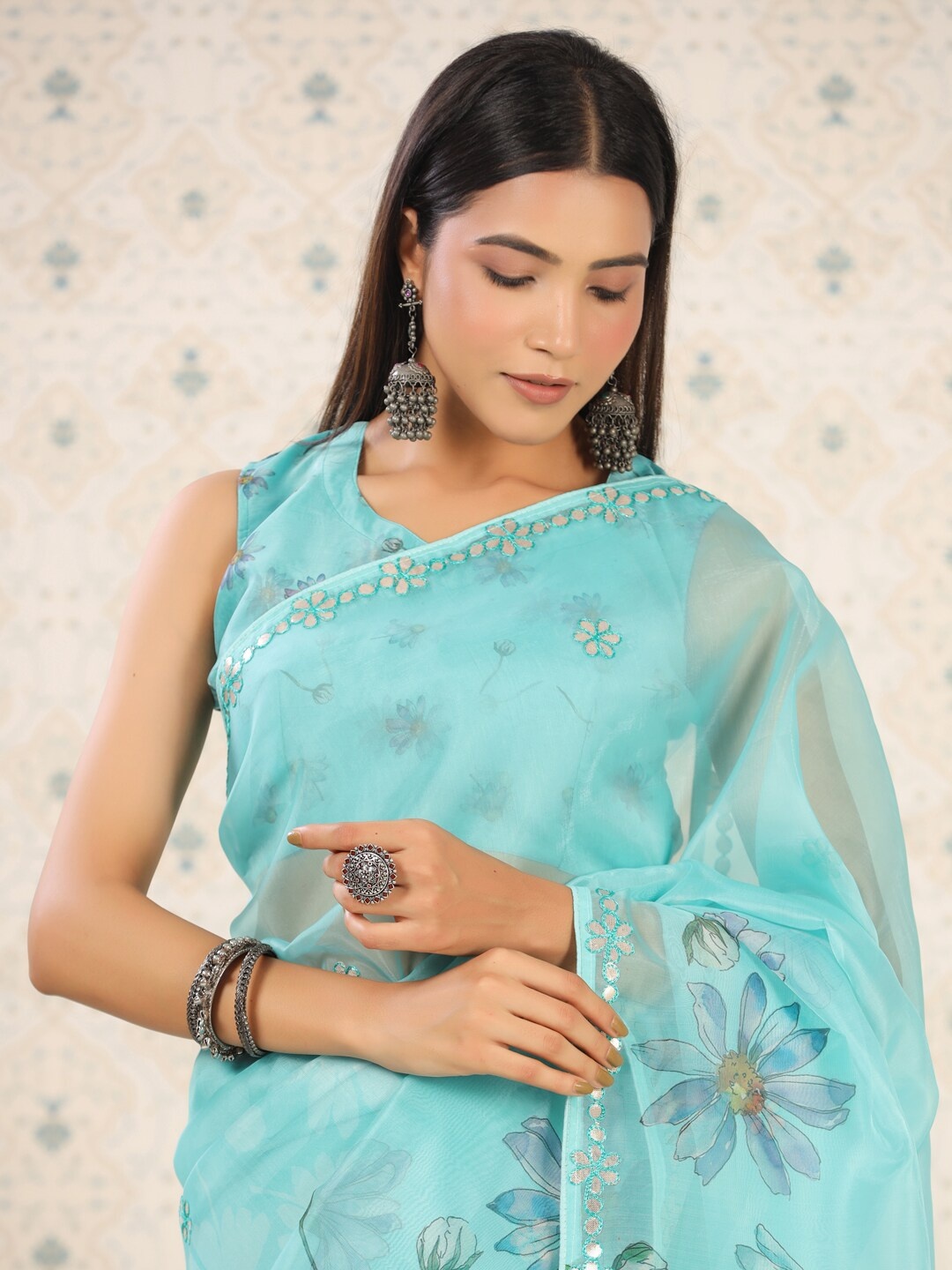 

Ode by House of Pataudi Turquoise Blue Floral Printed Mirror Work Organza Saree