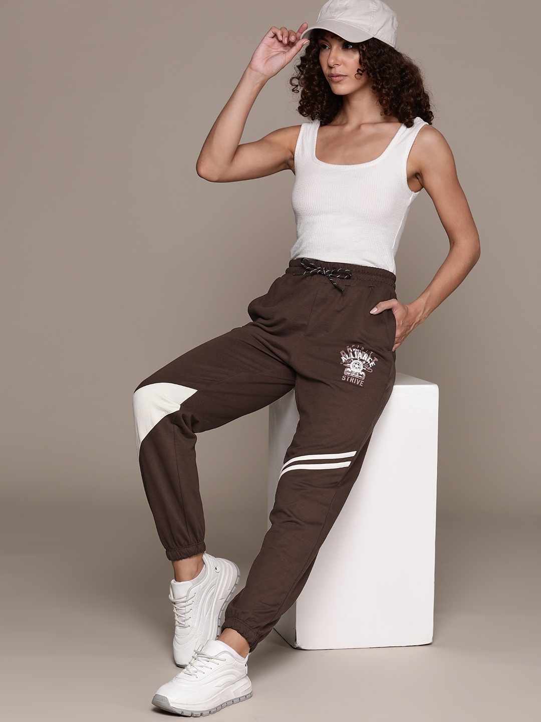 

The Roadster Lifestyle Co. RE/LAX Women Tapered Joggers with Striped Patch, Brown