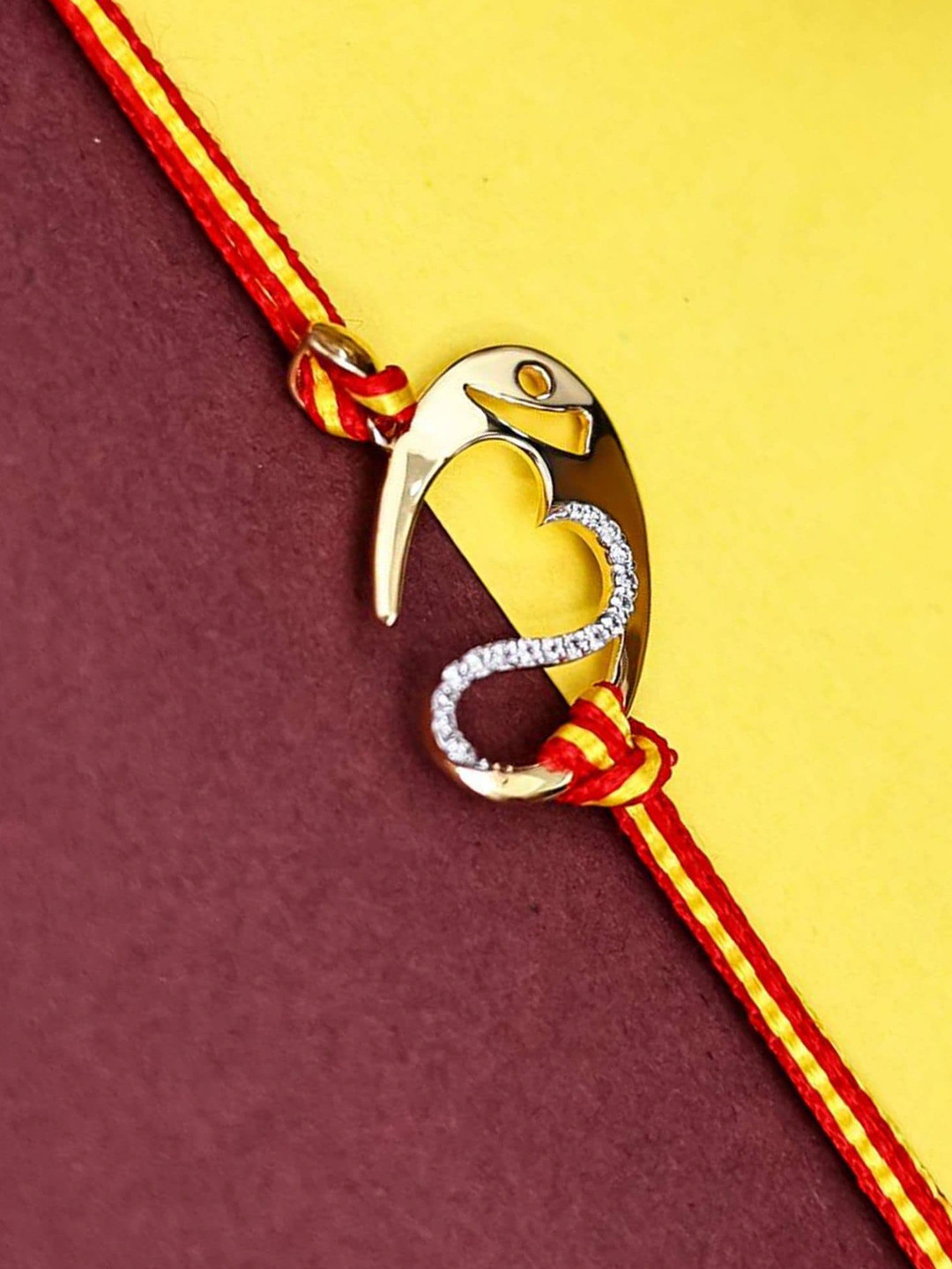 

KUBERBOX Men 18KT Gold Diamond Studded Divya Aum Pendant Rakhi-2.43gm