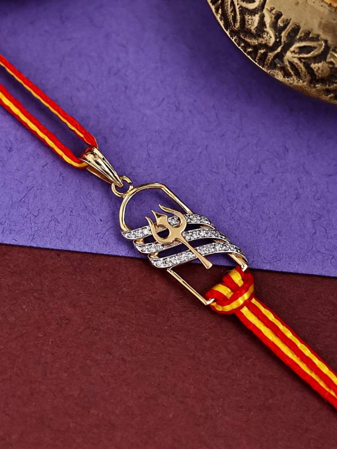 

KUBERBOX 18KT Gold Diamond-Studded Trishul Shivling Rakhi Cum Pendant-1.46 gm