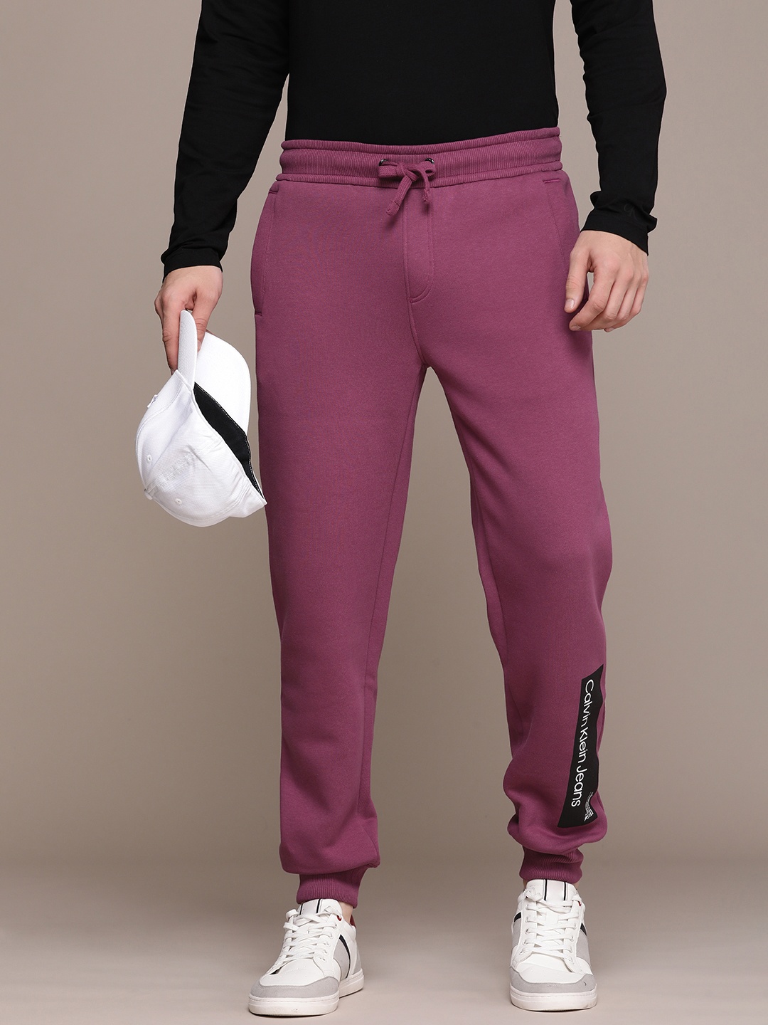

Calvin Klein Jeans Men Solid Mid-Rise Joggers Track Pants, Purple