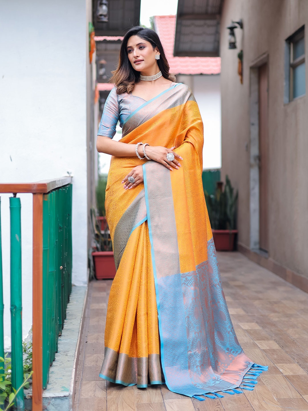 

Mitera Mustard & Blue Woven Design Zari Silk Blend Kanjeevaram Saree