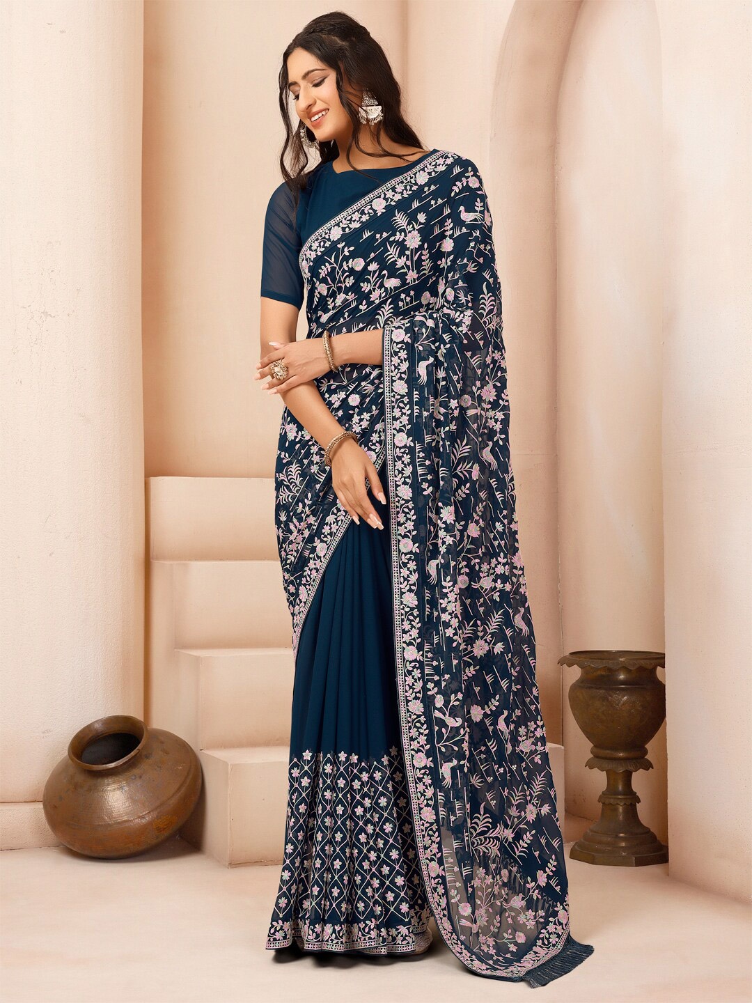 

Inddus Teal & White Floral Embroidered Sequinned Poly Georgette Saree