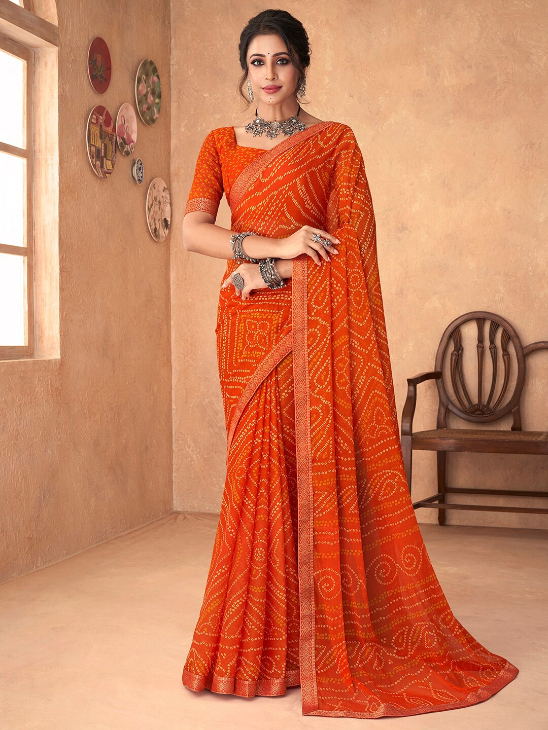 

Anouk Rustic Orange & Gold-Toned Bandhani Zari Pure Chiffon Bandhani Saree