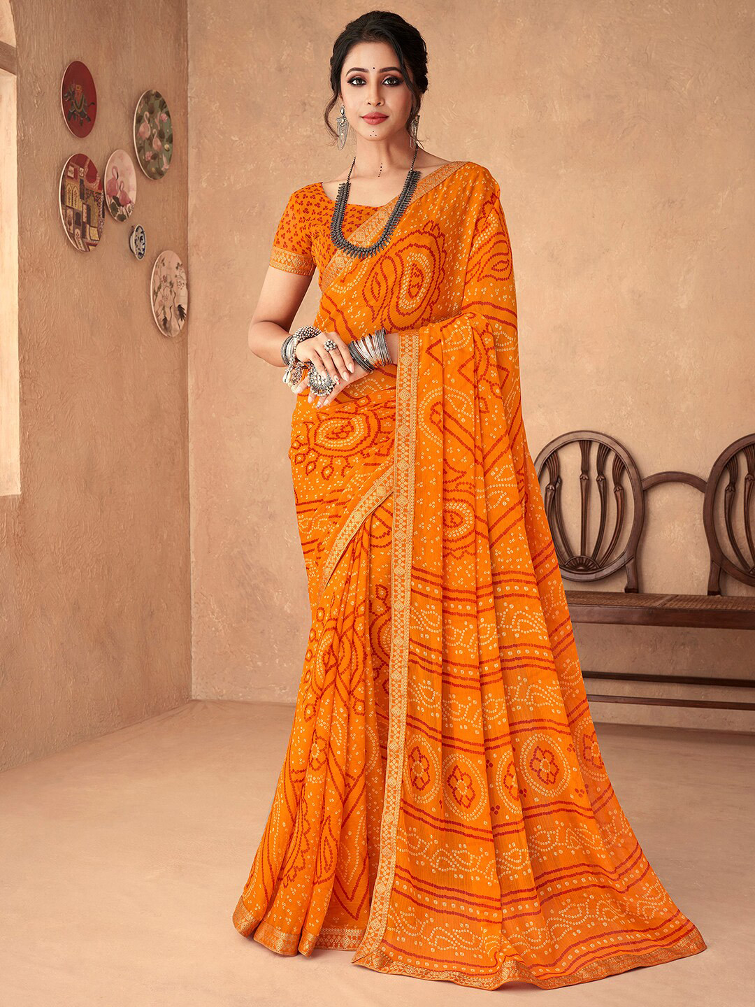 

Anouk Rustic Yellow & Red Bandhani Zari Pure Chiffon Bandhani Saree