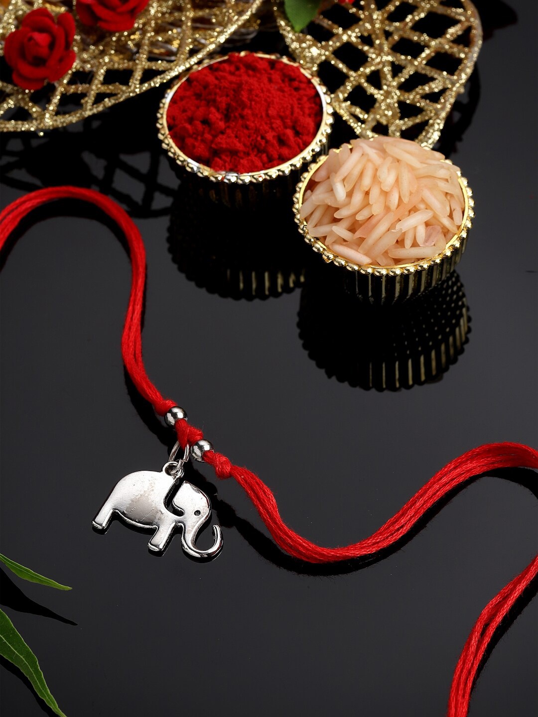 

PANASH Men Silver Plated Elephant Shaped & Beaded Thread Rakhi Comes With Roli Chawal