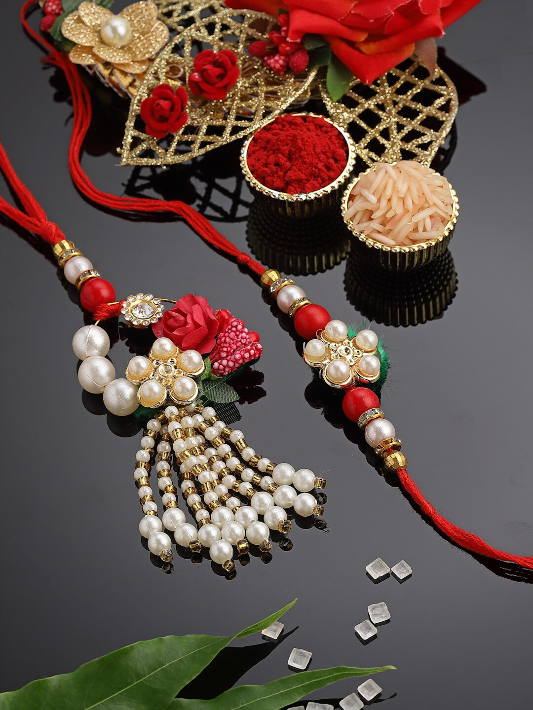 

PANASH Set Of 2 Gold-Plated Pearl Embellished Bhaiya Bhabhi Rakhi with Roli Chawal