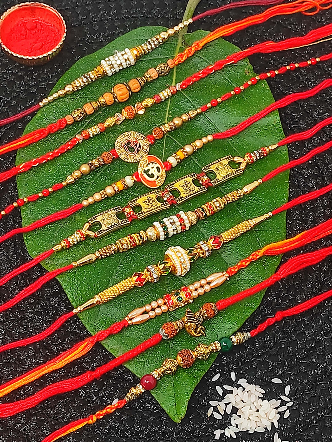 

CRAYTON Set Of 11 Beaded Thread Rakhis with Roli Chawal, Red
