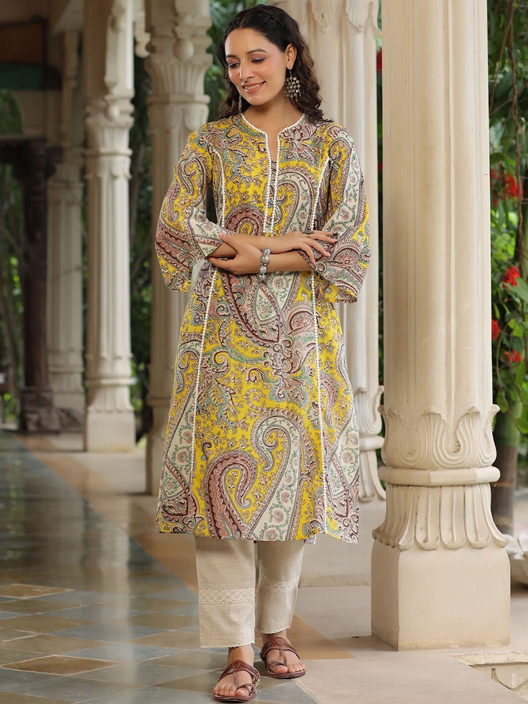 

Rain & Rainbow Ethnic Motifs Printed V- Neck Flared Sleeves Cotton Kurta, Yellow