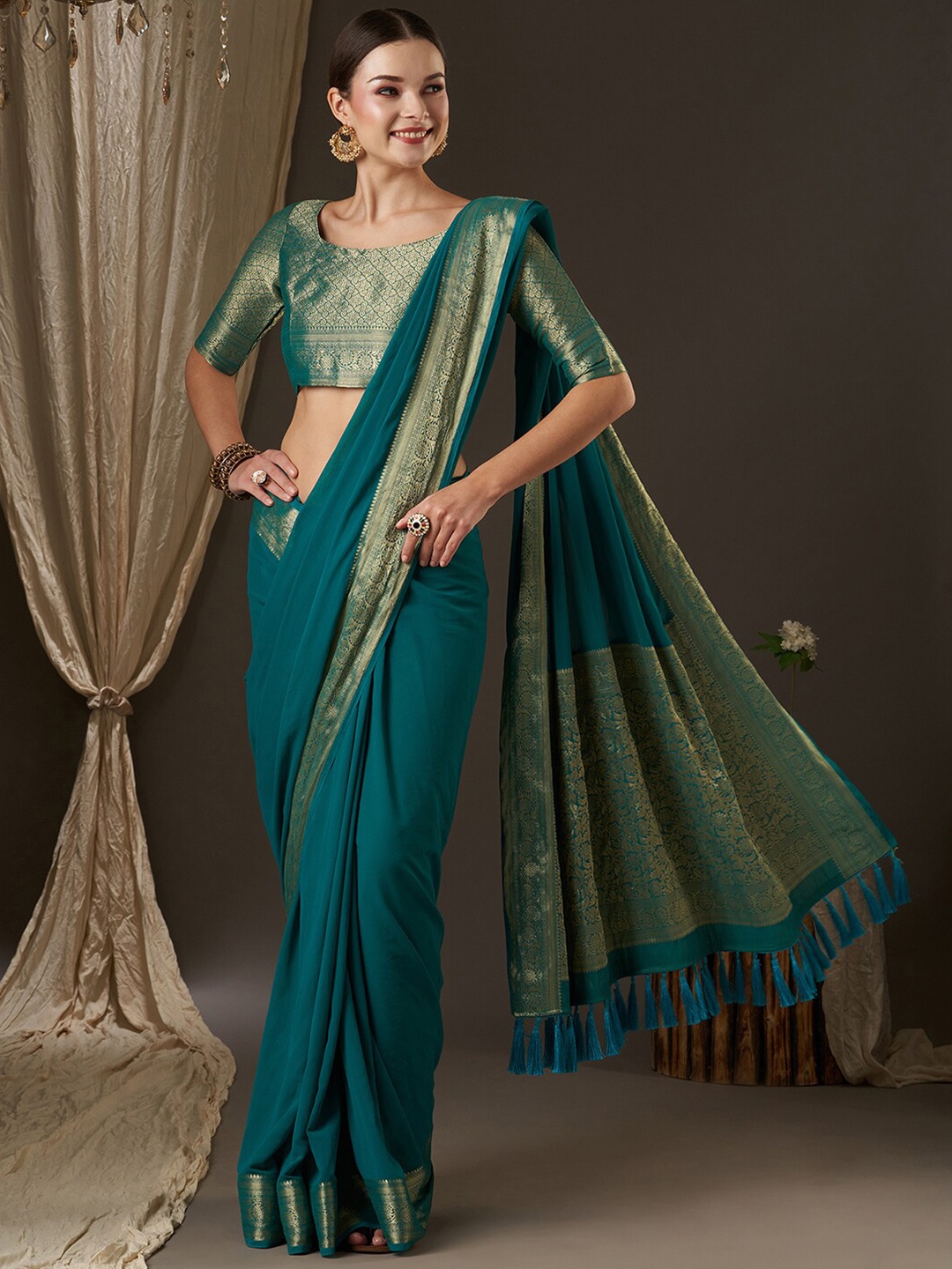 

Anouk Blue & Gold-Toned Zari Pure Georgette Kanjeevaram Saree